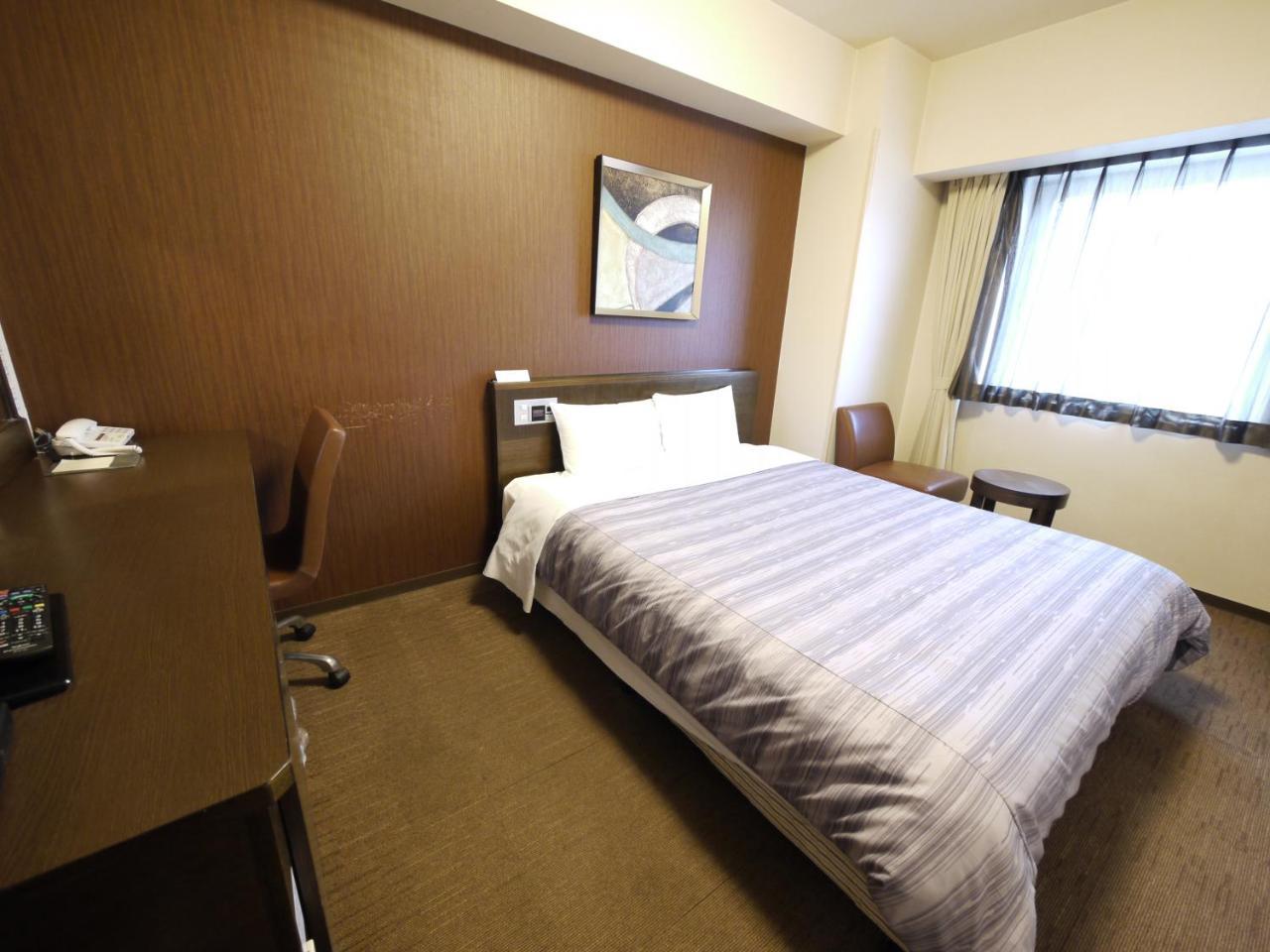 Hotel Route-Inn Chitose Ekimae Bagian luar foto
